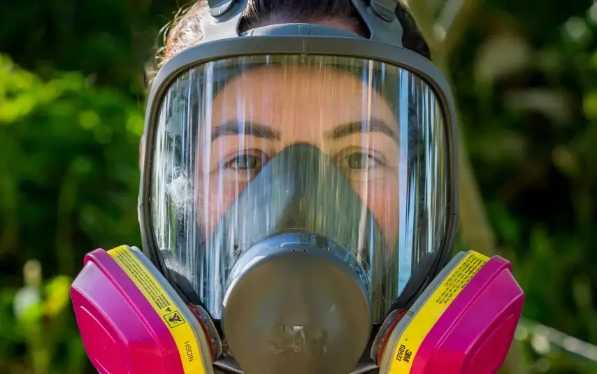 Worker wearing a full face respirator during a fit test